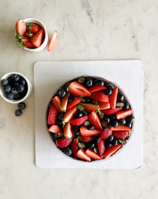 CHOCOLATE CAKE TOPPED WITH BERRIES