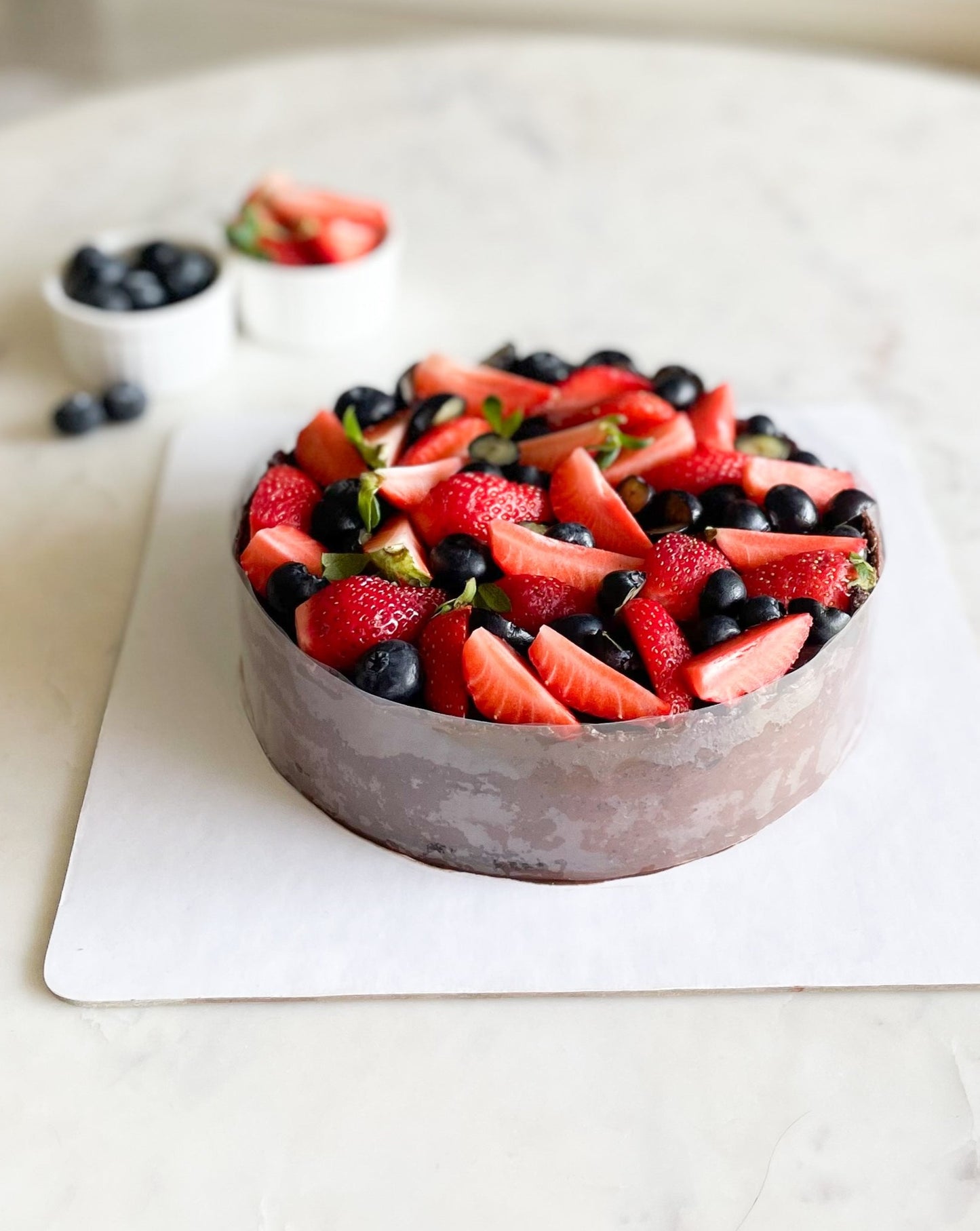 CHOCOLATE CAKE TOPPED WITH BERRIES